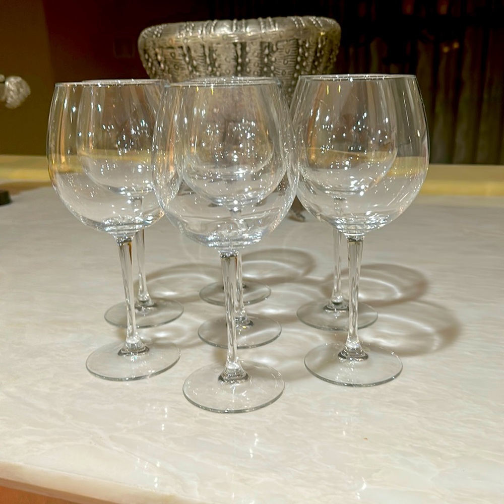 Seven tall wine glasses for sale. Only used a couple of times.